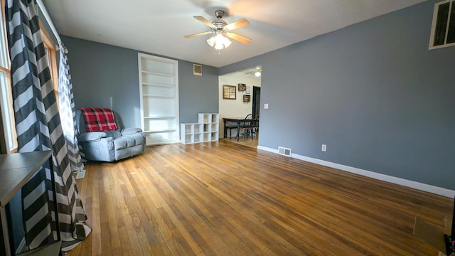 unfurnished room with hardwood / wood-style flooring and ceiling fan