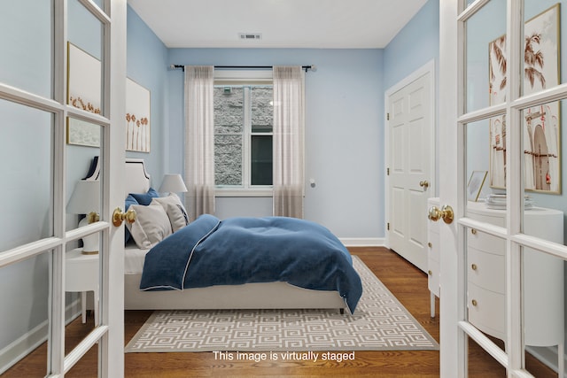 bedroom featuring wood-type flooring