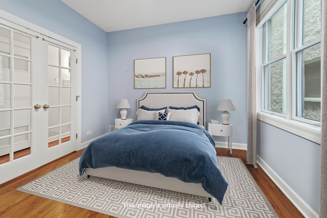 bedroom with hardwood / wood-style floors