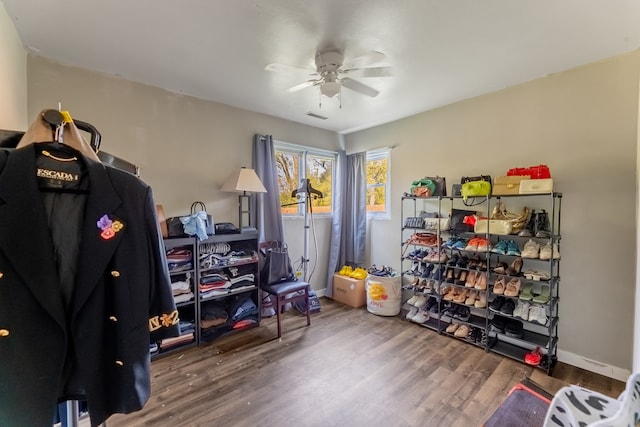 miscellaneous room featuring ceiling fan and hardwood / wood-style flooring