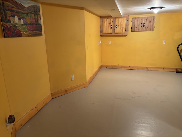 finished basement featuring baseboards