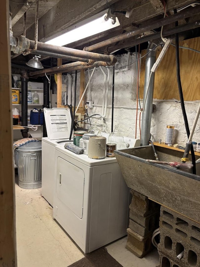 clothes washing area with laundry area and independent washer and dryer