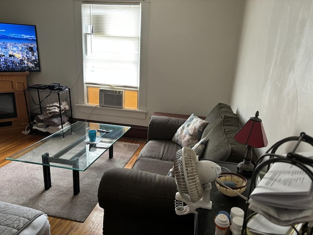 living room featuring hardwood / wood-style floors and cooling unit