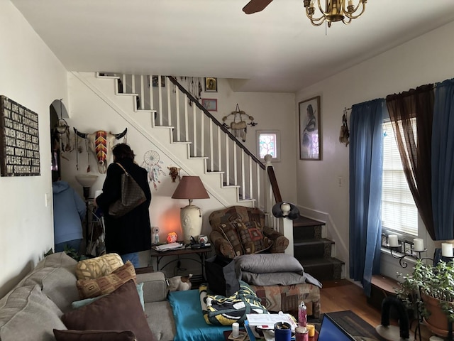 living room featuring hardwood / wood-style floors, ceiling fan, and a wealth of natural light