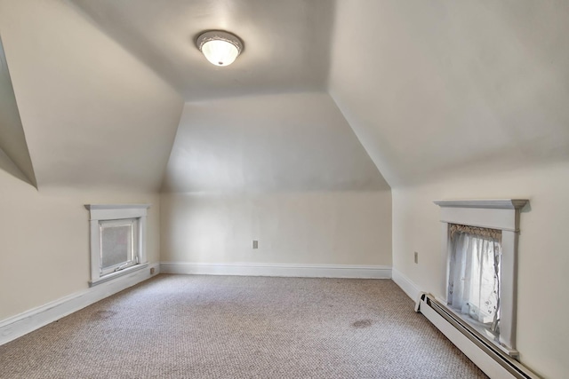 bonus room featuring lofted ceiling, light colored carpet, and a baseboard heating unit