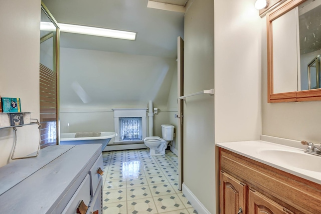 bathroom featuring vanity, toilet, and baseboard heating