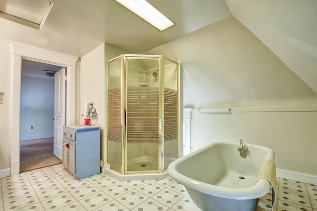 bathroom with lofted ceiling and independent shower and bath