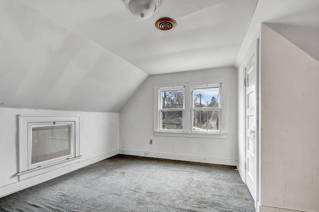 bonus room featuring carpet and lofted ceiling