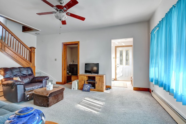 living room featuring ceiling fan, carpet floors, and a baseboard radiator