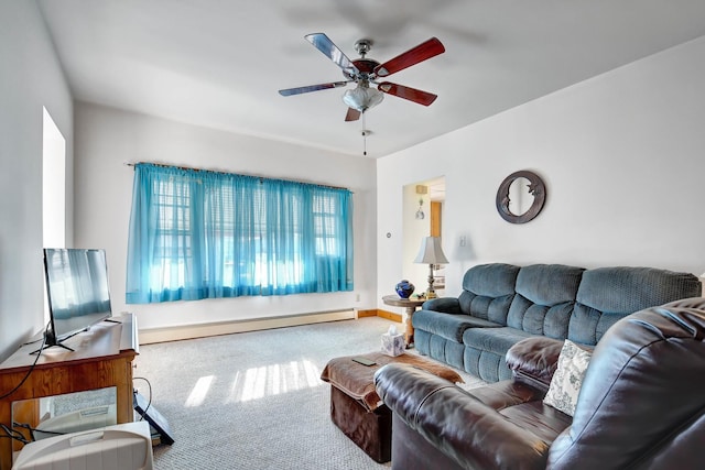 living room featuring ceiling fan, carpet floors, and a baseboard heating unit