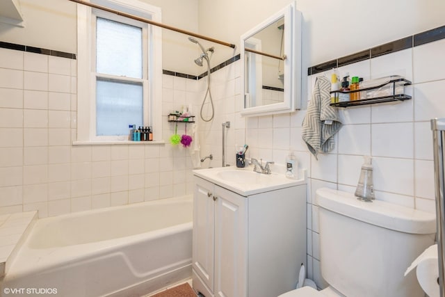 full bathroom featuring backsplash, vanity, tiled shower / bath combo, tile walls, and toilet