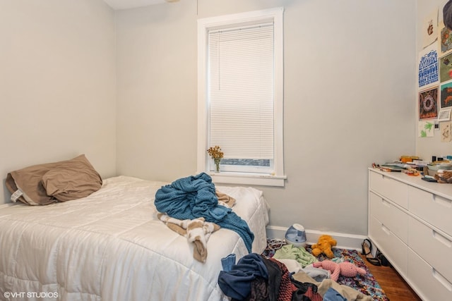 bedroom featuring dark wood-type flooring