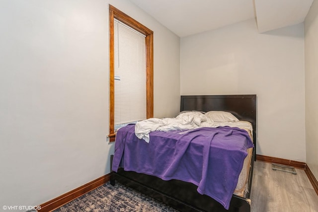 bedroom with wood-type flooring