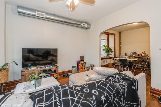 living room featuring hardwood / wood-style floors and ceiling fan