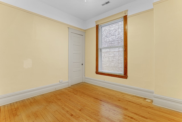 empty room with hardwood / wood-style flooring