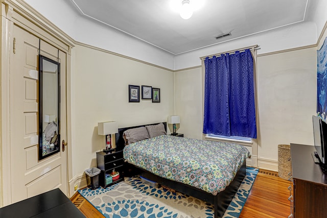 bedroom featuring hardwood / wood-style flooring