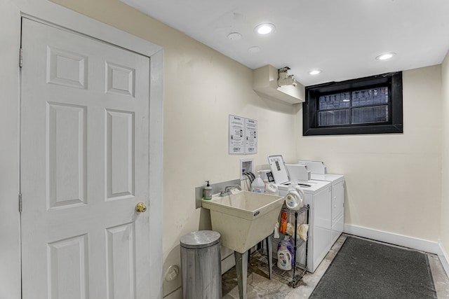 clothes washing area featuring separate washer and dryer