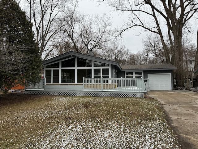 view of front of house featuring a garage and a wooden deck