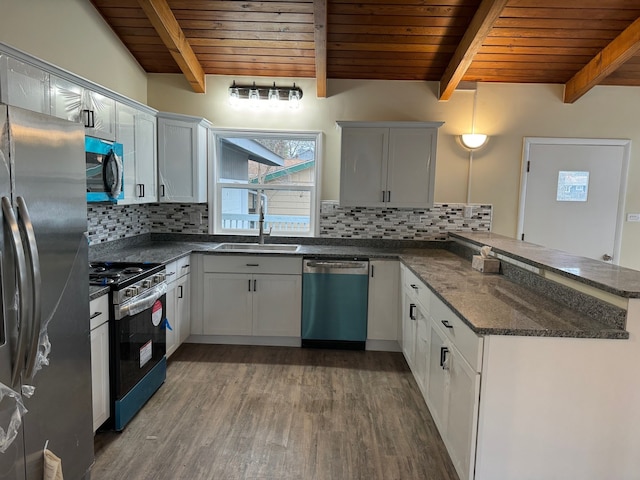 kitchen featuring white cabinets, kitchen peninsula, stainless steel appliances, and wooden ceiling