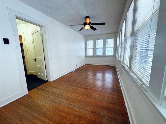 interior space with ceiling fan