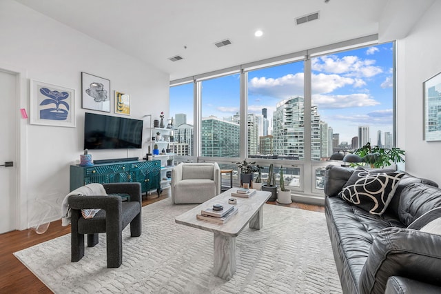 living room with hardwood / wood-style floors and expansive windows