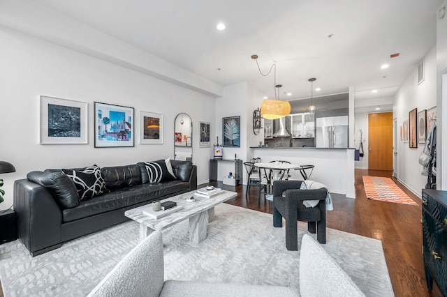 living room with dark hardwood / wood-style floors