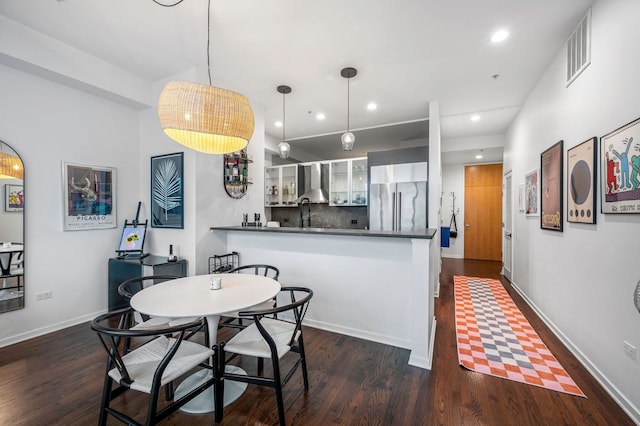 dining space with dark wood-type flooring