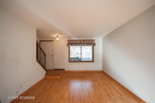 unfurnished living room featuring light hardwood / wood-style flooring