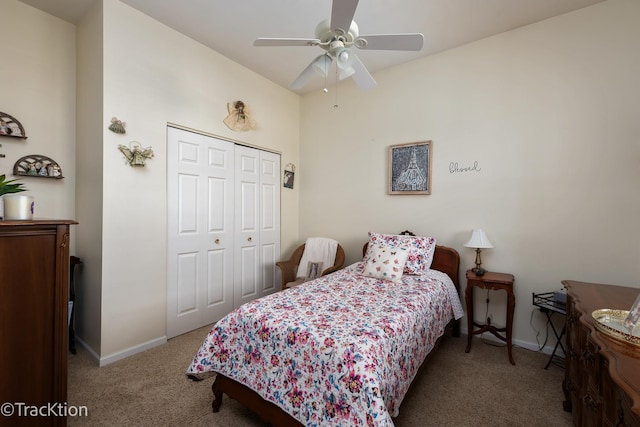 carpeted bedroom featuring a closet, ceiling fan, and baseboards