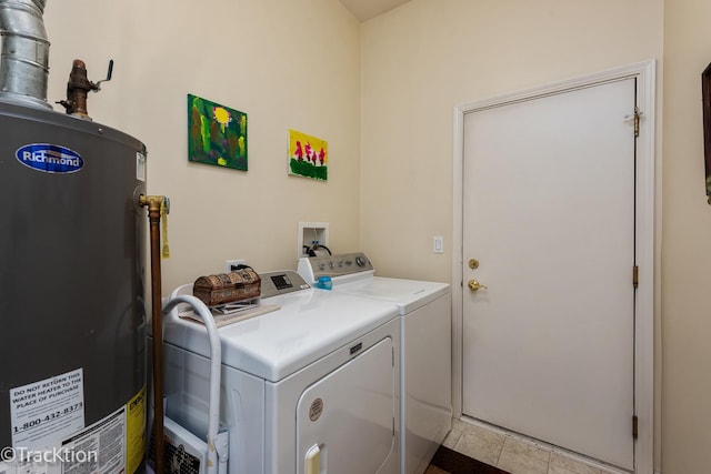 laundry room with water heater, laundry area, and independent washer and dryer