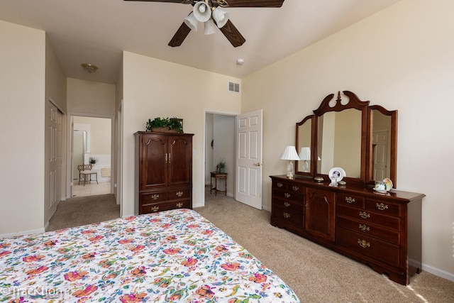 bedroom featuring baseboards, visible vents, a ceiling fan, and light colored carpet