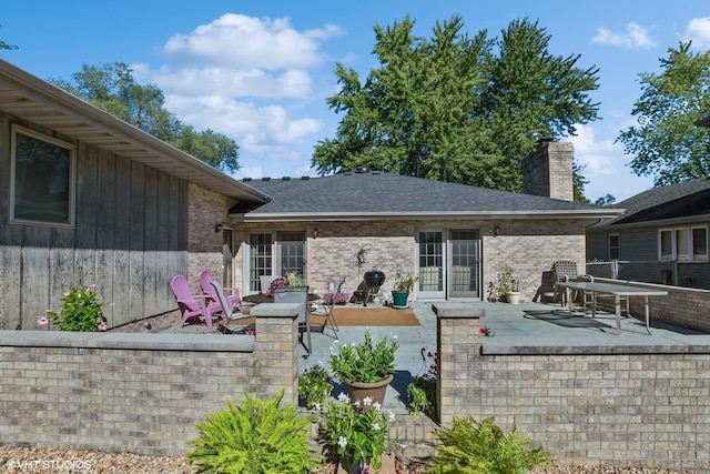 back of property featuring a patio area