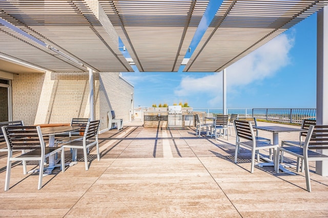 view of patio featuring a pergola and a water view