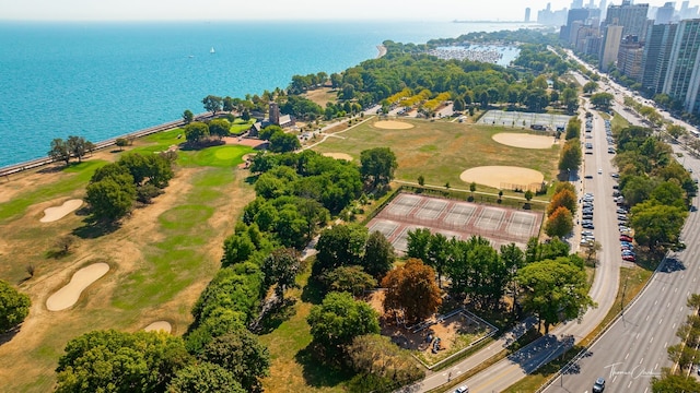 birds eye view of property with a water view