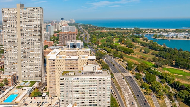 birds eye view of property with a water view