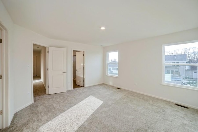 unfurnished bedroom with light carpet