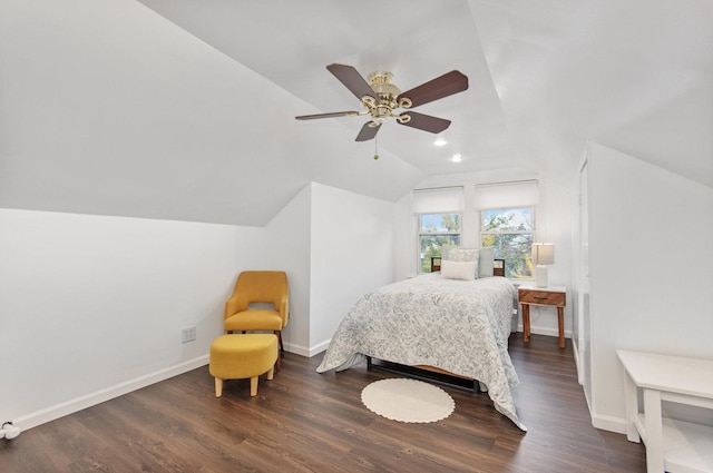 bedroom featuring ceiling fan, dark hardwood / wood-style floors, and vaulted ceiling