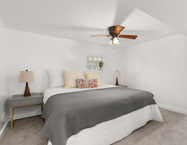 bedroom featuring light carpet and ceiling fan