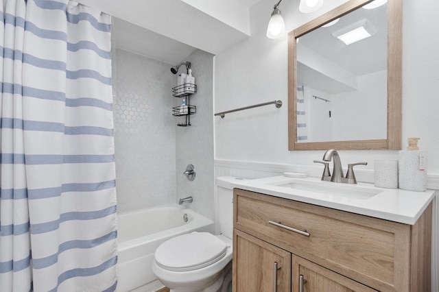 full bathroom with vanity, shower / bath combo, and toilet