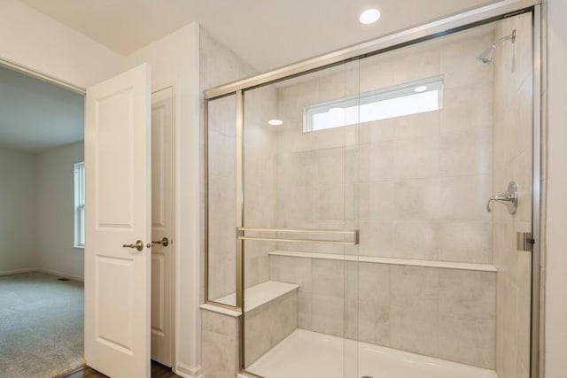 bathroom featuring an enclosed shower