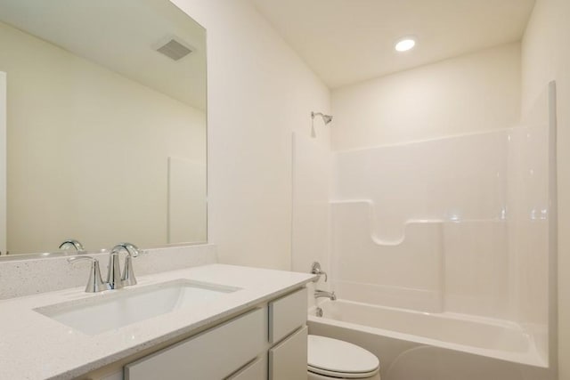 full bathroom with vanity, toilet, and shower / washtub combination