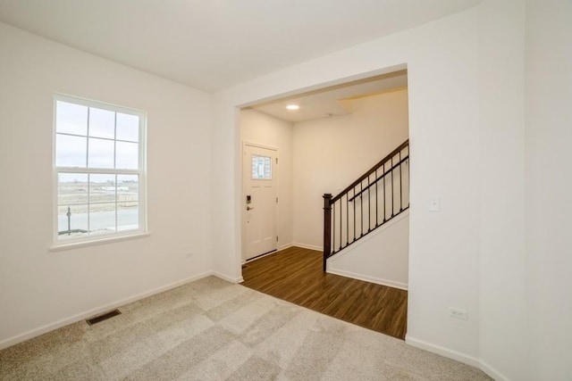 entryway featuring carpet floors