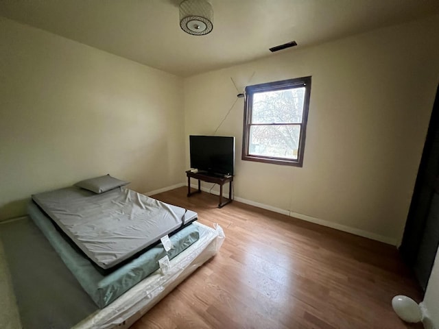 bedroom featuring hardwood / wood-style flooring