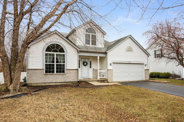 view of front facade with a garage and a front lawn