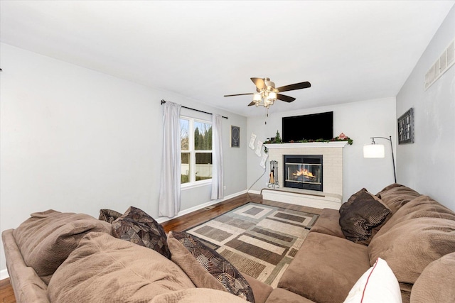 living room featuring hardwood / wood-style flooring and ceiling fan