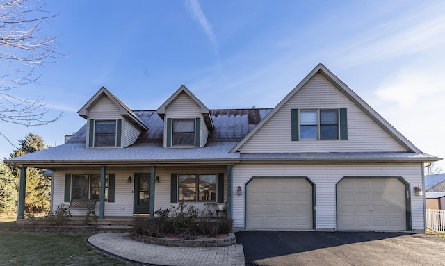 view of front of house with a garage and covered porch