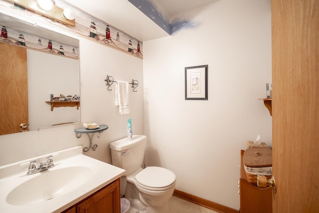 bathroom featuring vanity and toilet