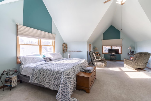 carpeted bedroom featuring ceiling fan and vaulted ceiling