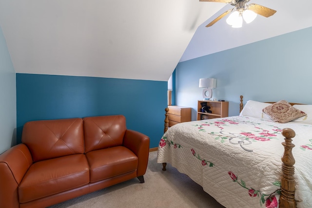 carpeted bedroom with ceiling fan and vaulted ceiling