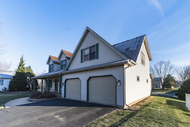 view of property exterior featuring a porch and a garage